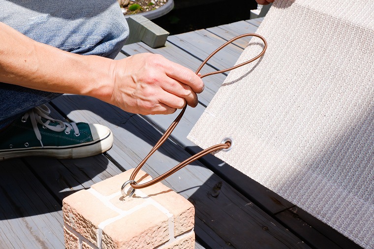 バンドをウエイトに引っ掛ける